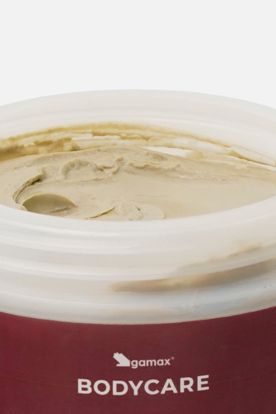 Confezione aperta di fango drenante Gamax Bodycare che mostra il prodotto cremoso all'interno