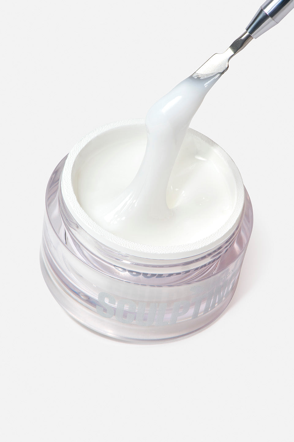 Gel UV unghie bianco opaco e denso in barattolo di vetro con spatola che preleva il prodotto, ideale per nail art e ricostruzione.