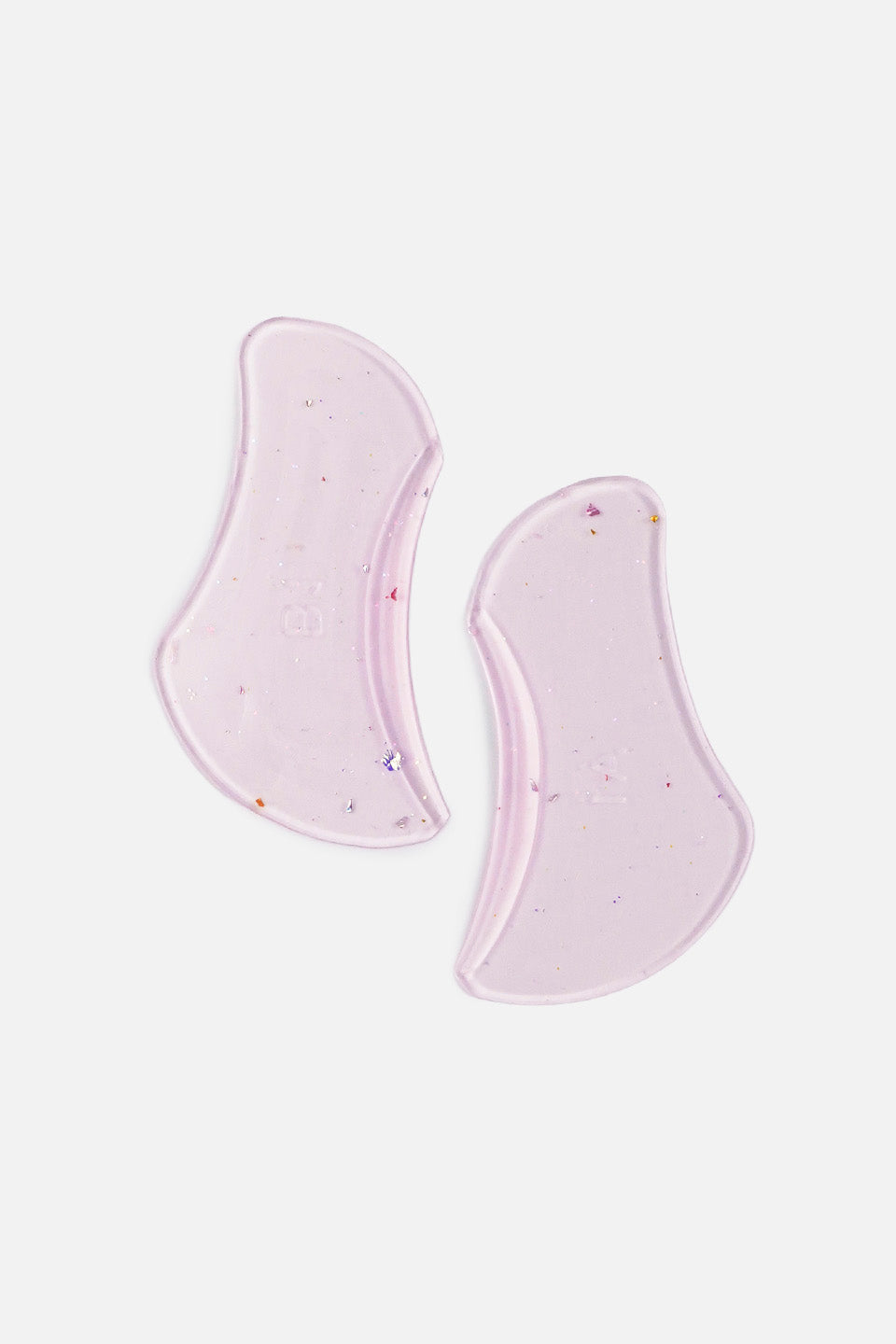 Coppia di bigodini piatti fucsia in silicone per laminazione ciglia coreana senza colla, disposti verticalmente su sfondo bianco neutro.