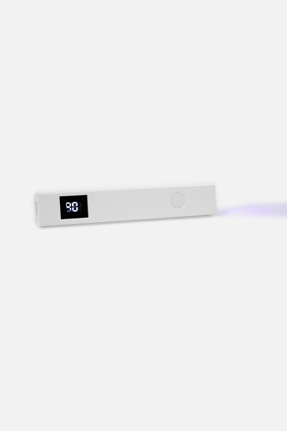 Lampada mini UV LED bianca distesa orizzontalmente che emette una luce soffusa di colore viola/UV dall'estremità destra; il display mostra il numero 90.