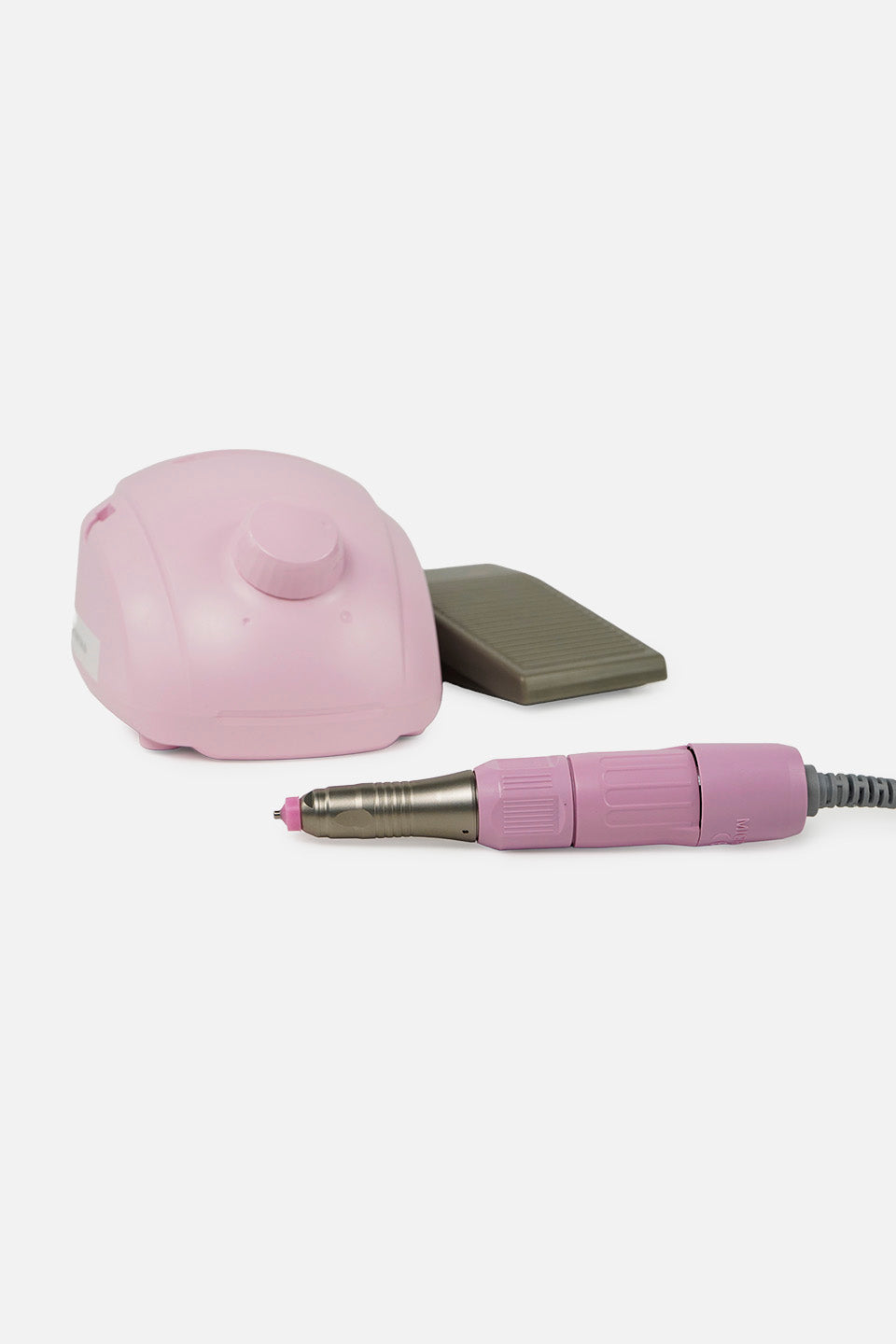 Micromotore unghie rosa con pedale collegato e manipolo in primo piano, vista laterale.